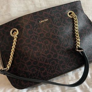 Calvin Klein purse Black and Gold with maroon accents